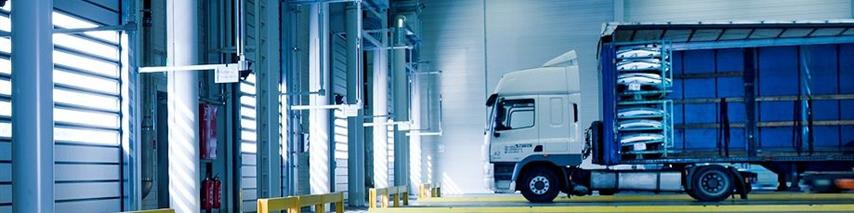 Inside of warehouse where lorries are reversed parked and stored for safety